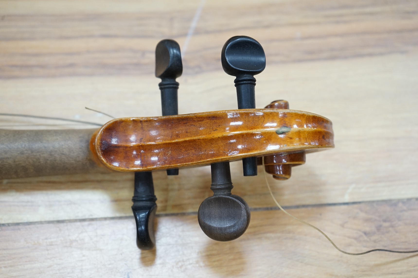 A cased full length violin, circa 1900, with bow, bears Stradivarius label to the interior. CITES Submission reference WVME8714